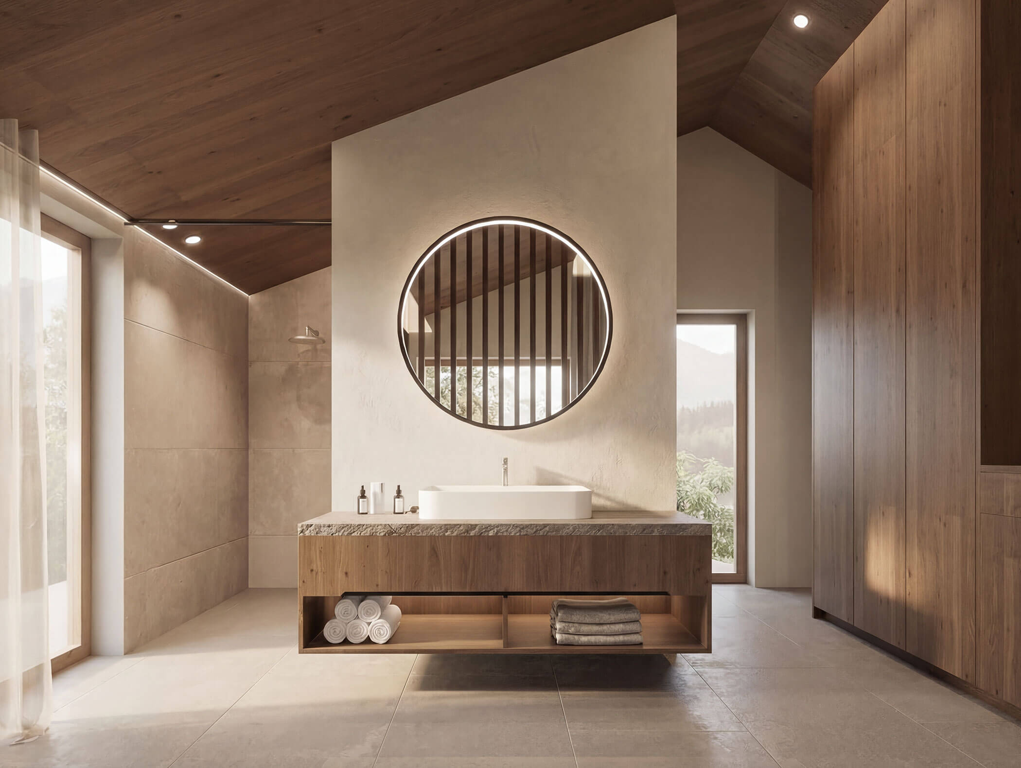 Modernes Badezimmer mit großem runden Spiegel, Holzakzenten, offenen Regalen und natürlichem Licht aus den Fenstern. - AMIL chalets dolomites